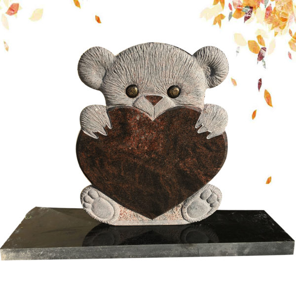 child headstone with bear statue and heart shape