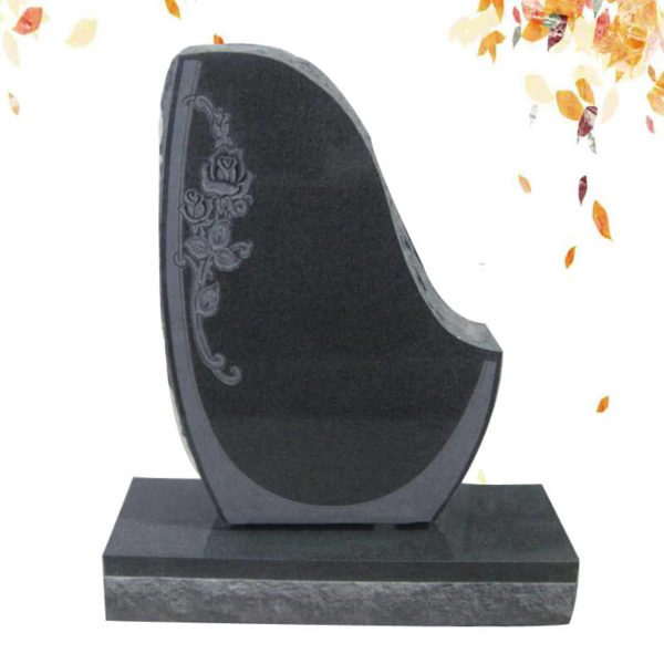 simple granite headstone with flower carved