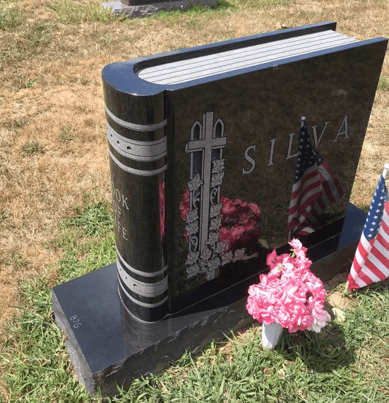 closed granite book headstone