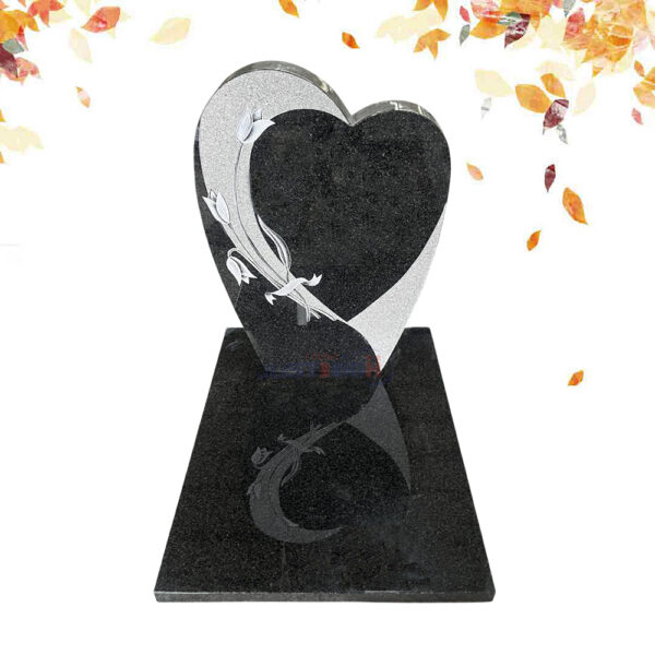 Heart-shaped black granite headstone with flower carvings
