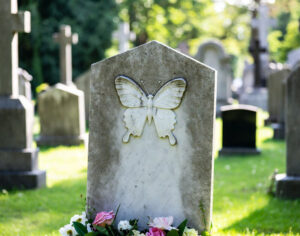 What does a butterfly on a headstone mean